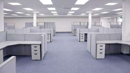 Pre-owned office furniture and office cubicles prepared for liquidation and resale in New Jersey.